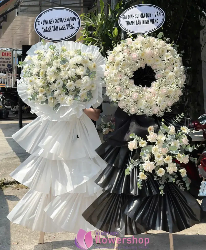 Elegant white funeral flower arrangement for a memorial service