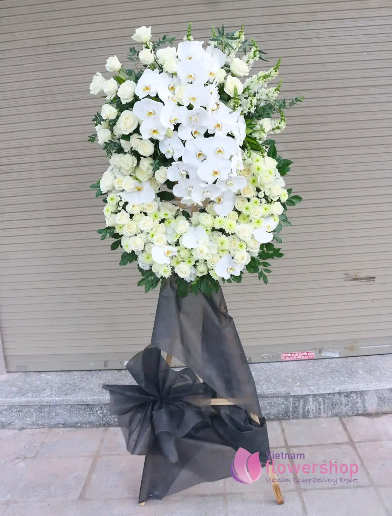White and green flowers arranged for a respectful funeral tribute