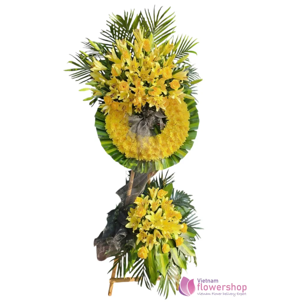 traditional Sympathy flower arrangement with yellow colors for expressing condolences