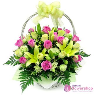 Basket of pink roses mixed yellow lilies